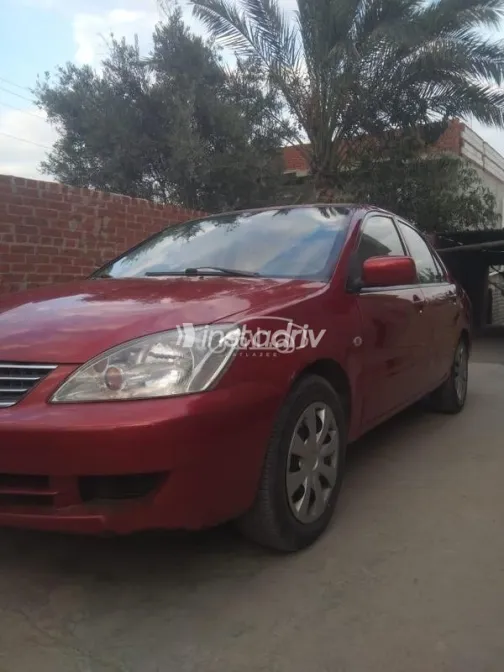 ميتسوبيشي لانسر بومة 2013 أحمر مستعملة للبيع - 4