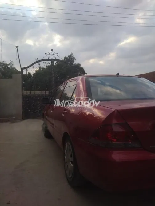 ميتسوبيشي لانسر بومة 2013 أحمر مستعملة للبيع - 6