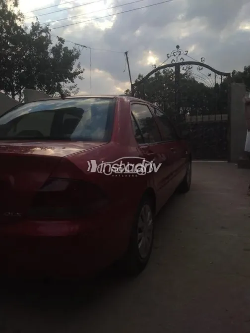 ميتسوبيشي لانسر بومة 2013 أحمر مستعملة للبيع - 8