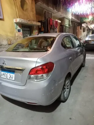 ميتسوبيشي اتراج 2015 أبيض مستعملة للبيع