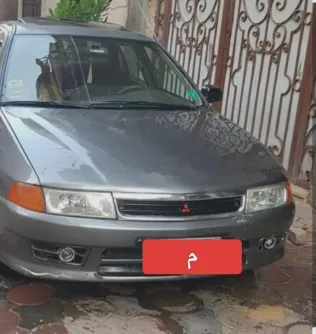 ميتسوبيشي لانسر كرستالة 1999 رمادي مستعملة للبيع