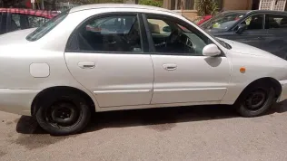 دايو لانوس 2004 أبيض مستعملة للبيع