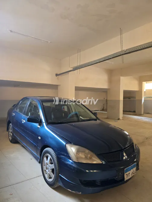 ميتسوبيشي لانسر بومة 2007 أبيض مستعملة للبيع - 8