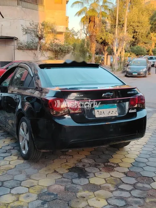 شيفروليه كروز 2010 أسود مستعملة للبيع - 7