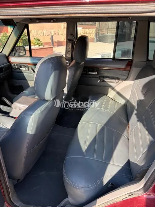 جيب شيروكي 1997 أحمر غامق مستعملة للبيع - 5