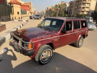 جيب شيروكي 1997 أحمر غامق مستعملة للبيع