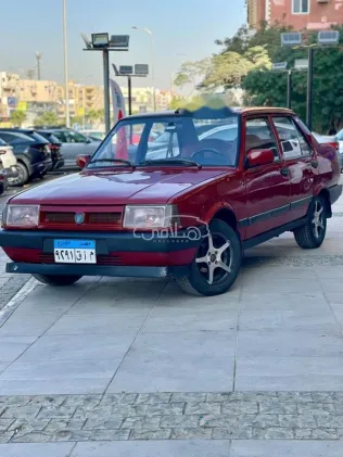 فيات شاهين 2002 أحمر غامق مستعملة للبيع
