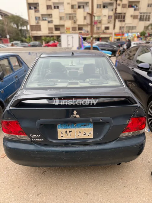 ميتسوبيشي لانسر بومة 2007 أبيض مستعملة للبيع - 2