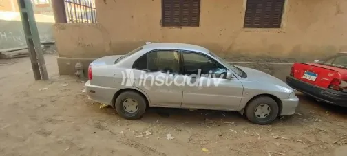 ميتسوبيشي ميراج 2006 فضي مستعملة للبيع - 1