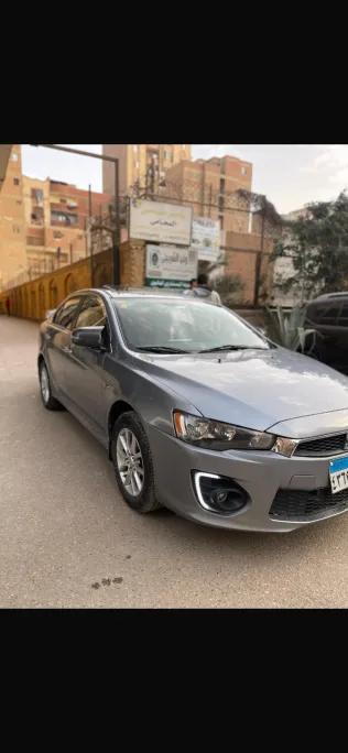 ميتسوبيشي لانسر اى اكس شارك 2016 أبيض مستعملة للبيع