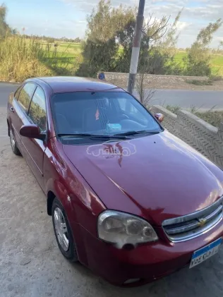 شيفروليه أوبترا 2009 أحمر غامق مستعملة للبيع
