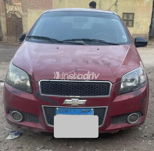 شيفروليه افيو 2016 أحمر غامق مستعملة للبيع - 1