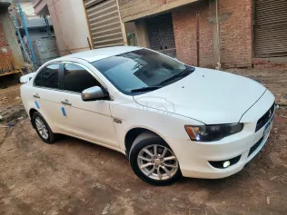 ميتسوبيشي لانسر اى اكس شارك 2015 أبيض مستعملة للبيع