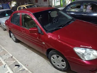 ميتسوبيشي لانسر بومة 2008 أحمر مستعملة للبيع