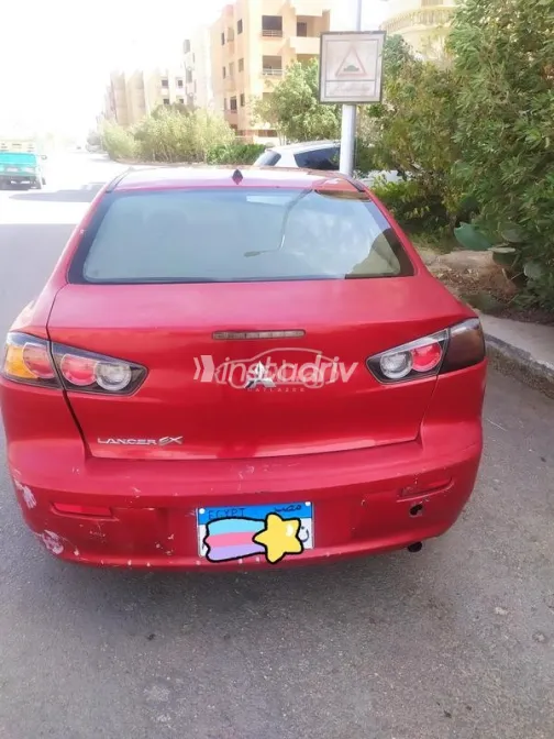 ميتسوبيشي لانسر اى اكس شارك 2017 أحمر غامق مستعملة للبيع - 1