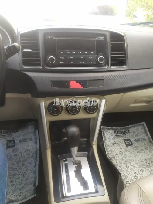 ميتسوبيشي لانسر اى اكس شارك 2017 أحمر غامق مستعملة للبيع - 3