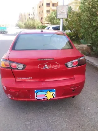 ميتسوبيشي لانسر اى اكس شارك 2017 أحمر غامق مستعملة للبيع