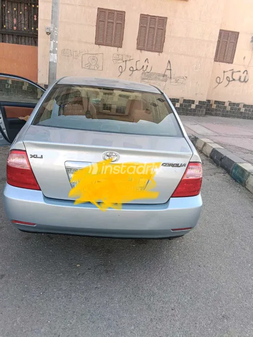 تويوتا كورولا 2005 أبيض مستعملة للبيع - 3