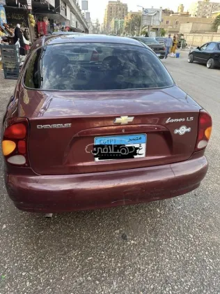 شيفروليه لانوس 2015 أحمر غامق مستعملة للبيع