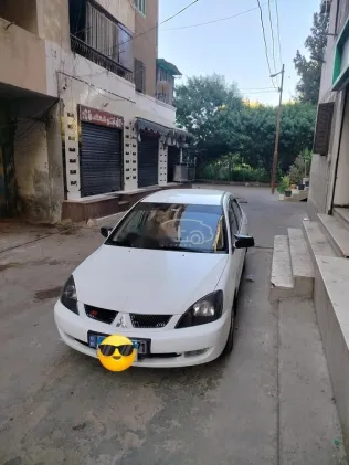 ميتسوبيشي لانسر بومة 2007 أبيض مستعملة للبيع
