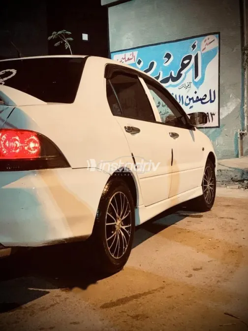 ميتسوبيشي لانسر بومة 2014 أبيض مستعملة للبيع - 4