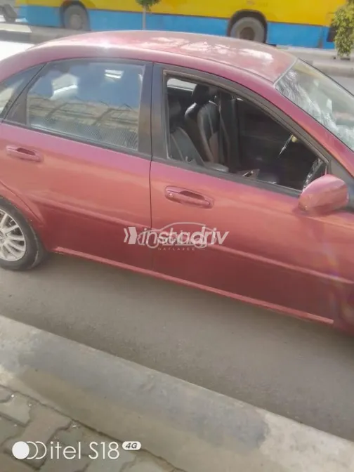 شيفروليه أوبترا 2008 أحمر غامق مستعملة للبيع - 2