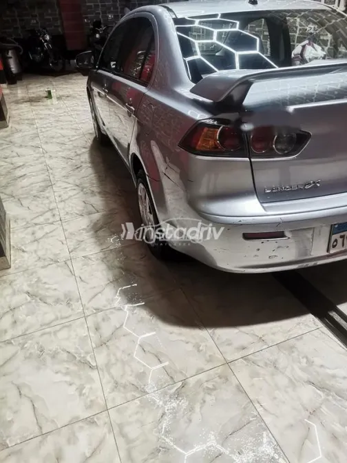 ميتسوبيشي لانسر اى اكس شارك 2015 فضي مستعملة للبيع - 4