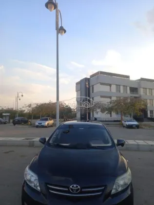 تويوتا كورولا 2010 أسود مستعملة للبيع