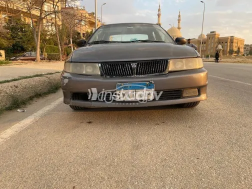 ميتسوبيشي لانسر كرستالة 1999 رمادي غامق مستعملة للبيع - 1
