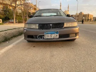 ميتسوبيشي لانسر كرستالة 1999 رمادي غامق مستعملة للبيع