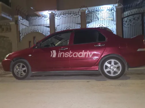 ميتسوبيشي لانسر بومة 2009 أبيض مستعملة للبيع - 2