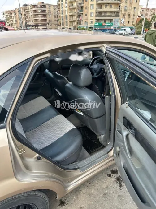 شيفروليه أوبترا 2006 ذهبي مستعملة للبيع - 5