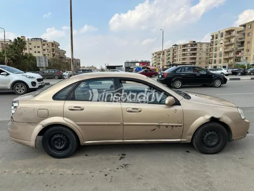 شيفروليه أوبترا 2006 ذهبي مستعملة للبيع - 6