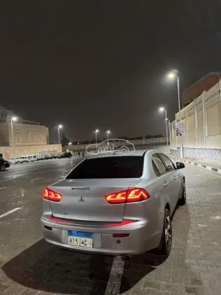 ميتسوبيشي لانسر اى اكس شارك 2015 فضي مستعملة للبيع