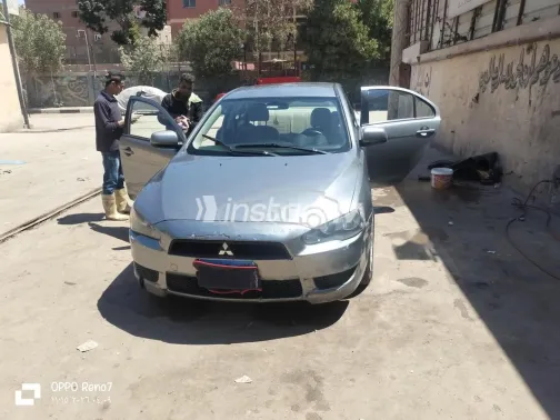 ميتسوبيشي لانسر 2014 رمادي غامق مستعملة للبيع - 1