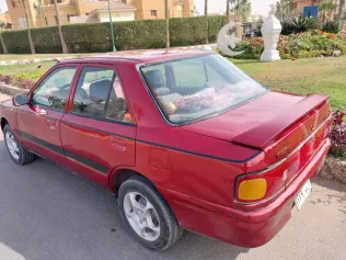 مازدا 323 1992 أبيض مستعملة للبيع