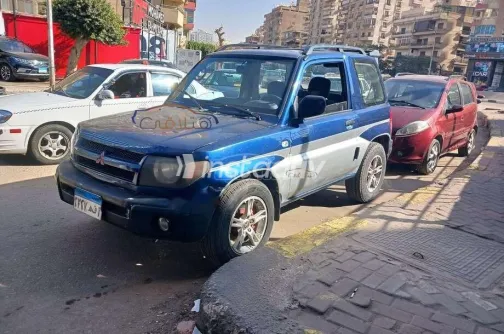 ميتسوبيشي مونتيرو 2003 أبيض مستعملة للبيع - 3