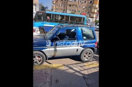 ميتسوبيشي مونتيرو 2003 أبيض مستعملة للبيع - 4