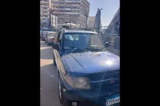 ميتسوبيشي مونتيرو 2003 أبيض مستعملة للبيع