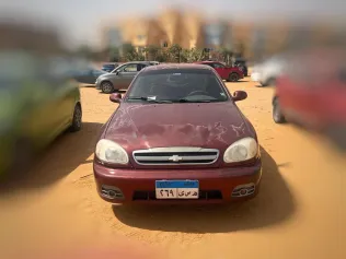 شيفروليه لانوس 2015 أحمر غامق مستعملة للبيع