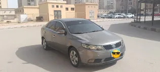 كيا سيراتو 2010 أبيض مستعملة للبيع