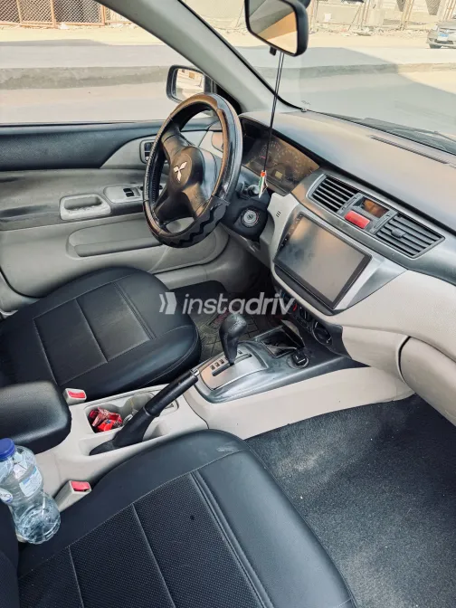 ميتسوبيشي لانسر 2009 أبيض مستعملة للبيع - 4