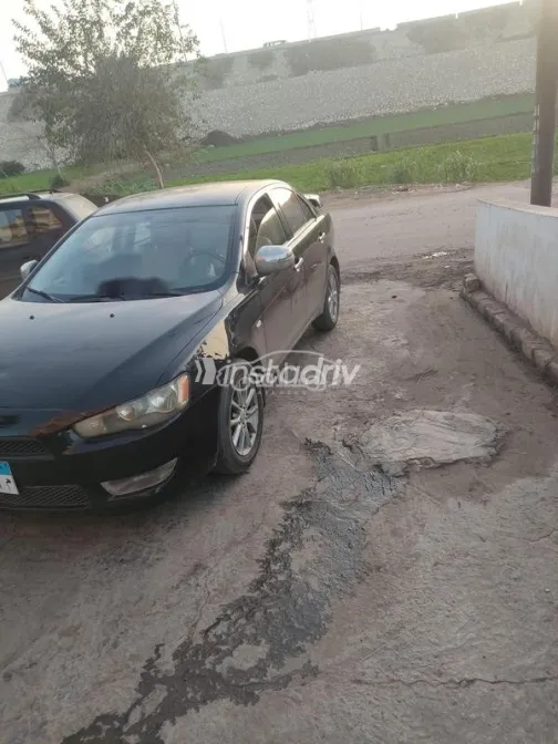 ميتسوبيشي لانسر اى اكس شارك 2015 أبيض مستعملة للبيع - 1