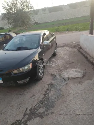 ميتسوبيشي لانسر اى اكس شارك 2015 أبيض مستعملة للبيع