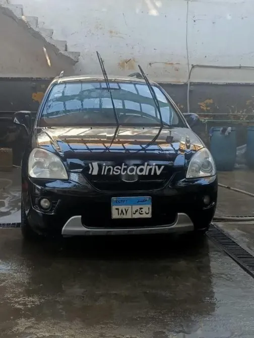 كيا كارينز 2010 أسود مستعملة للبيع - 2