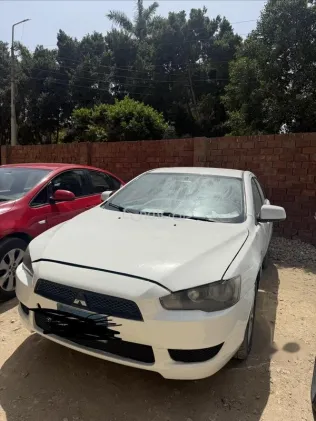 ميتسوبيشي لانسر اى اكس شارك 2014 أبيض مستعملة للبيع