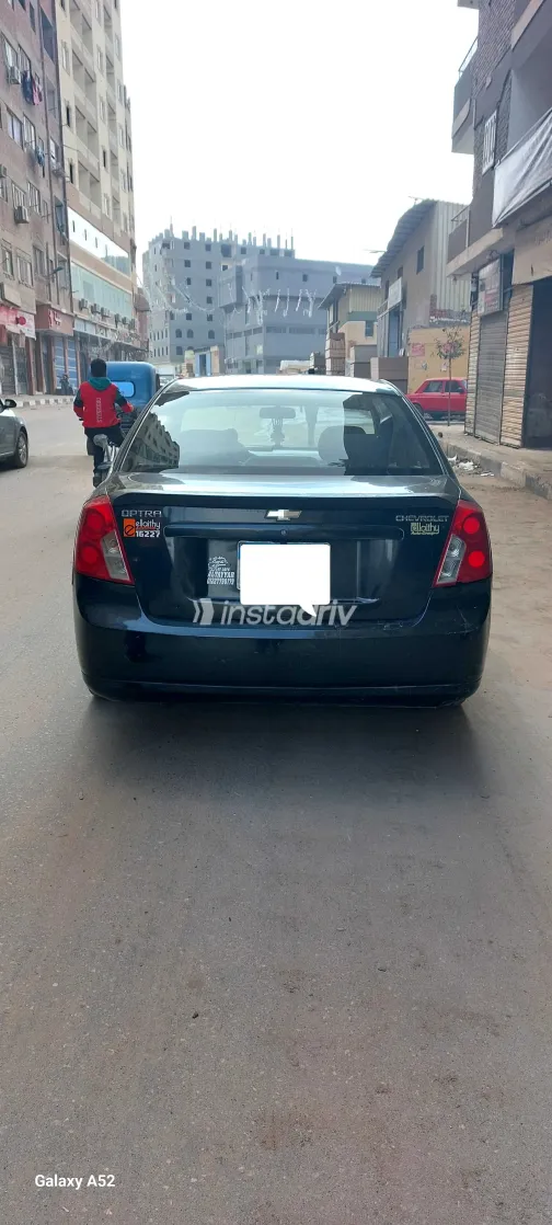 شيفروليه أوبترا 2011 أبيض مستعملة للبيع - 3