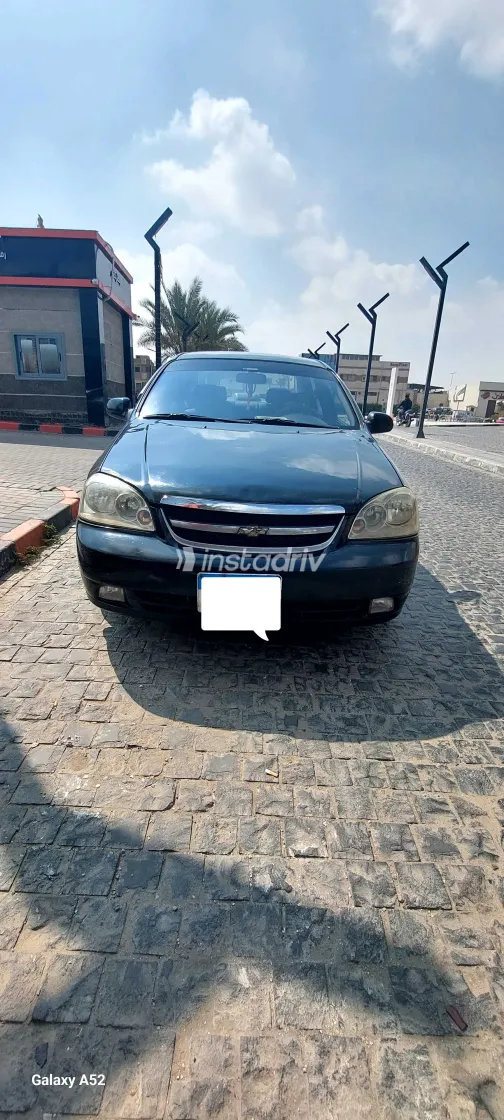 شيفروليه أوبترا 2011 أبيض مستعملة للبيع - 5