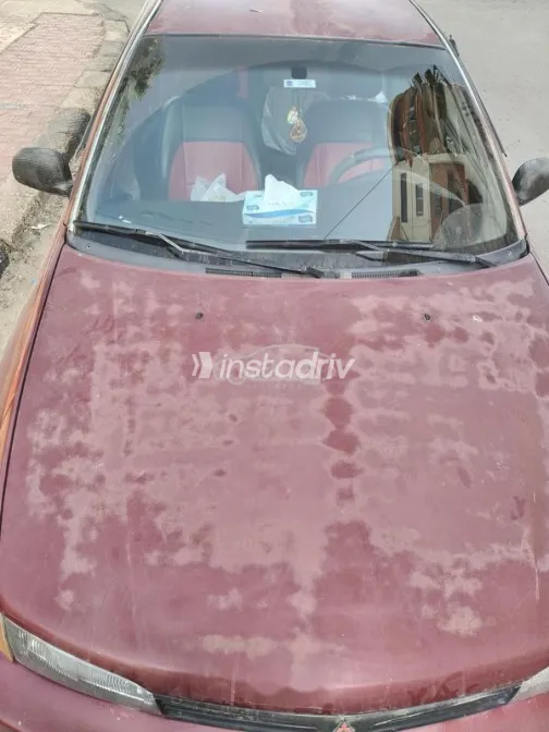 ميتسوبيشي ميراج 1999 أحمر غامق مستعملة للبيع - 6