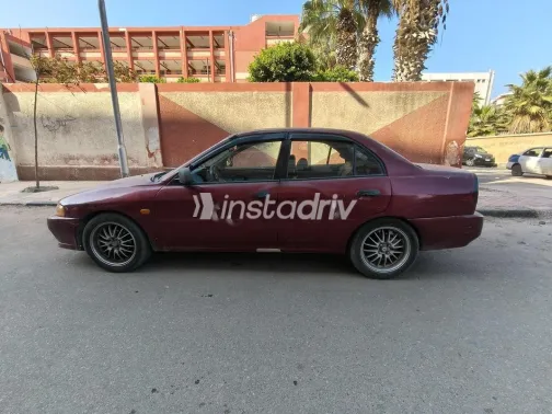 ميتسوبيشي ميراج 1999 أحمر غامق مستعملة للبيع - 2